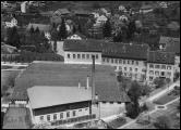 Gut zu sehen sind am linken Bildrand noch die beiden Widerlager der ehemaligen S.G.B. Ergolzbrcke. Die Aufnahme wurde am 15. Mai 1925 von Walter Mittelholzer gemacht.